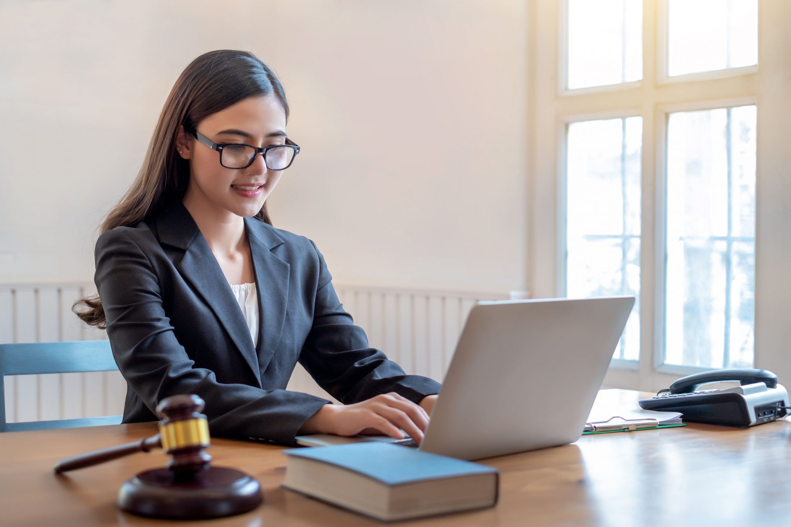 Copia de young-lawyer-asian-woman-working-at-office-with-la-2023-11-27-05-29-52-utc